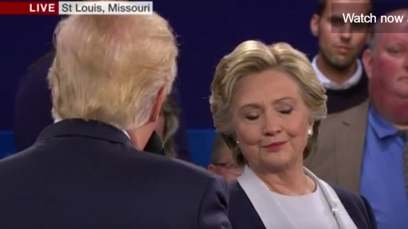 Second US Presidential Debate - Body Language Analysis - Donald Trump is scolding Hilary Clinton for deleting emails, ans she glances down and gestures arrogance suggesting she is smarter and mocking Trump. 