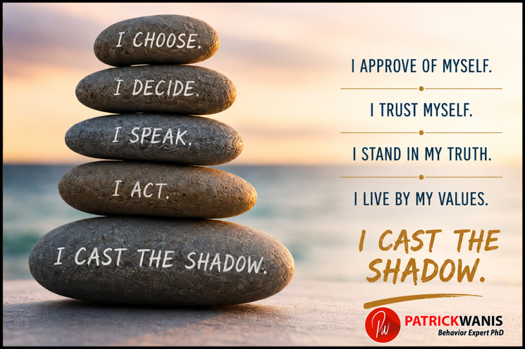 Stack of balanced stones on a beach at sunrise displaying the words "I Choose, I Decide, I Speak, I Act, I Cast the Shadow," symbolizing self-approval, personal power, psychological sovereignty, and living according to one's values, and not Living Under Someone Else's Shadow